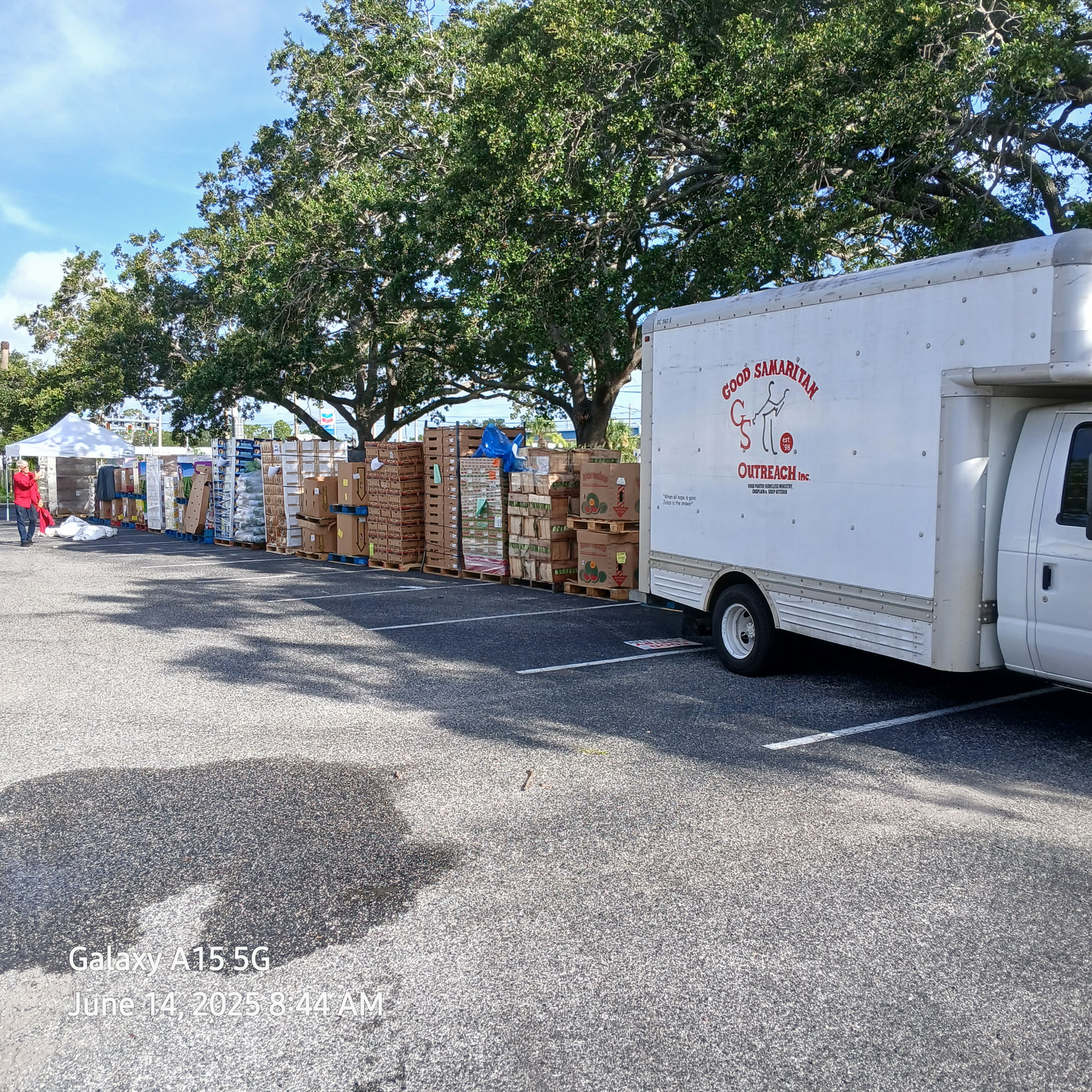 Good Samaritan Outreach truck at a large outdoor food distribution in Orlando